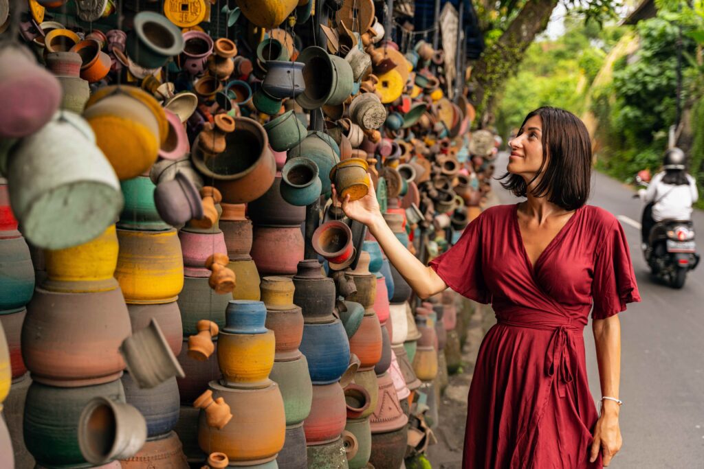 Cheerful young woman walking on local market